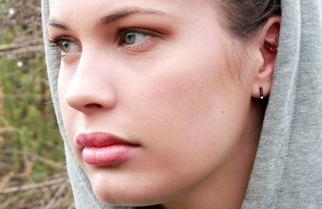 Young model wearing small Black Cherry Moon Earring